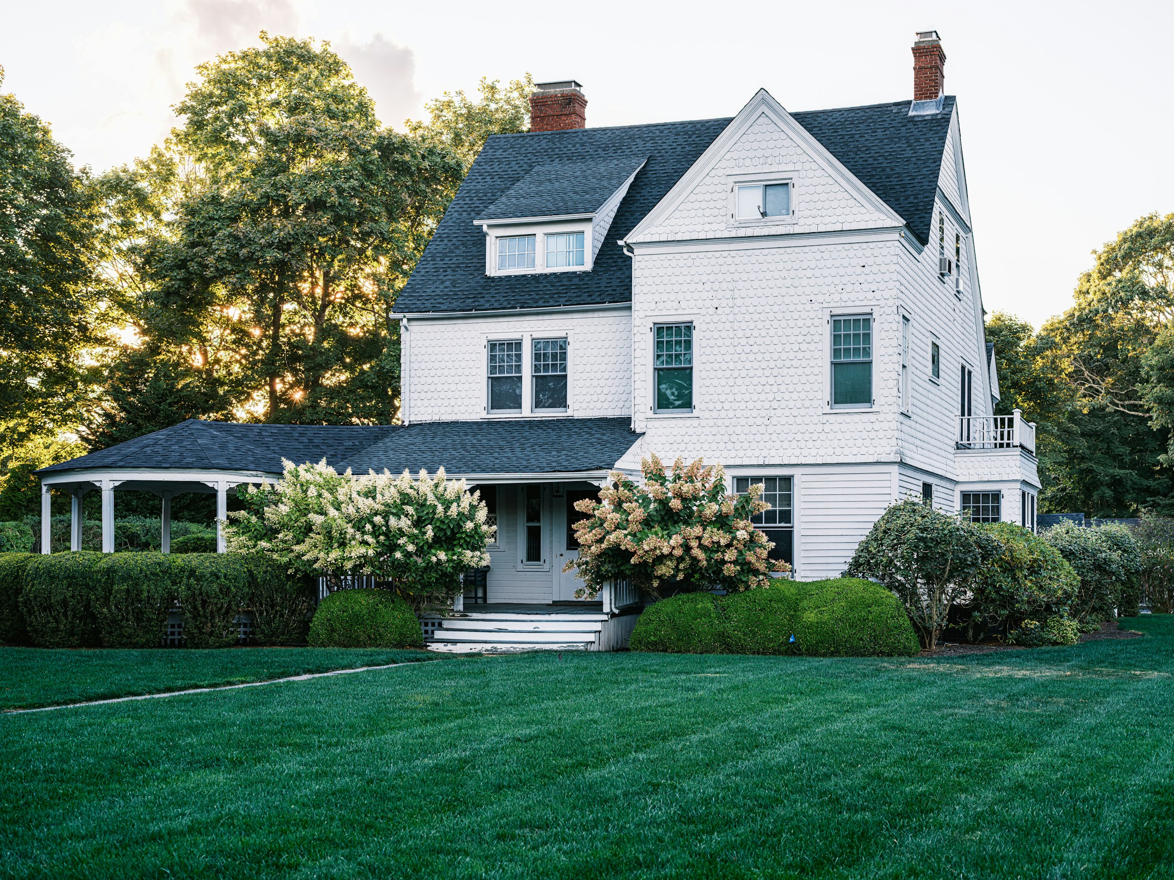 Classic white residence photographed in natural evening light